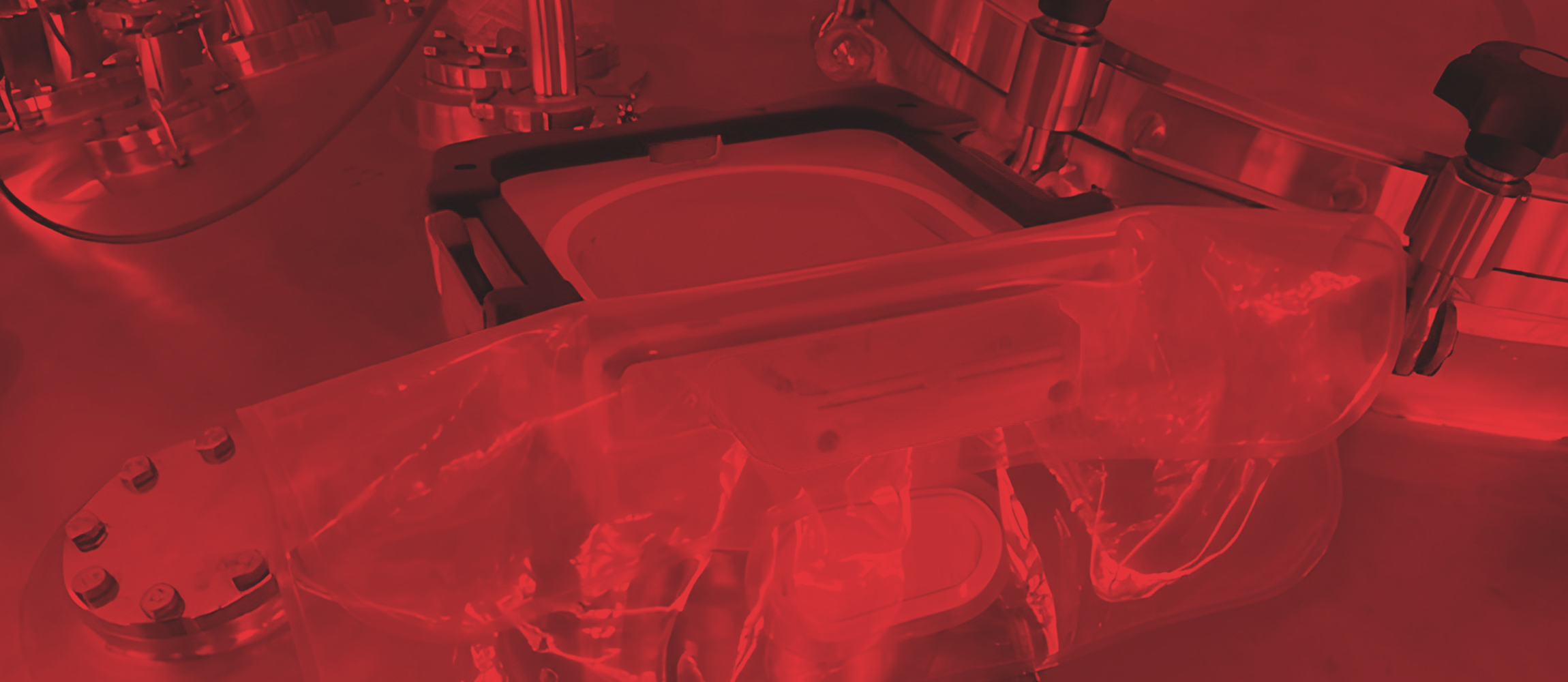 Ezi-Dock CSV containment system with flexible liner attached to stainless steel biopharma tank for secure HPAPI and pharmaceutical powder transfer in pharmaceutical manufacturing.